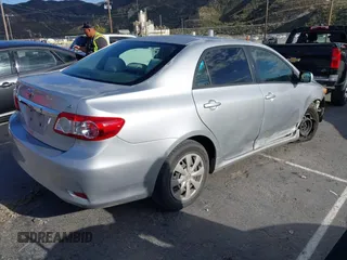 2011 Toyota Corolla L with VIN JTDBU4EE7BJ108265, listed as a IAAI auction lot 41969221 with 104,273 mi miles. Bid and sale history available at carsss.com. Image 4.