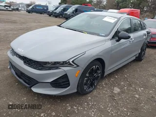 2024 Kia K5 GT-Line z VIN 5XXG64J23RG253362, wystawiony jako IAAI lot #41848600 z przebiegiem 17 481 mil mil oraz . Historia ofert i sprzedaży dostępna na DreamBid. Obrazek 2.