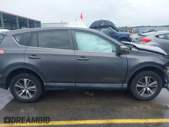 2018 Toyota RAV4 XLE with VIN 2T3RFREV5JW701564, listed as a IAAI auction lot 41976067 with 128,404 mi miles. Bid and sale history available at carsss.com. Image 13.