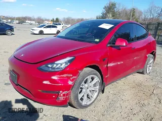 2023 Tesla Model Y Long Range with VIN 7SAYGDEE8PA121218, listed as a IAAI auction lot 41888923 with 34,796 mi miles. Bid and sale history available at carsss.com. Image 2.