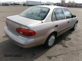 1998 Chevrolet Prizm Lsi z VIN 1Y1SK5285WZ438757, wystawiony jako IAAI lot #41896020 z przebiegiem 106 369 mil mil oraz . Historia ofert i sprzedaży dostępna na DreamBid. Obrazek 4.