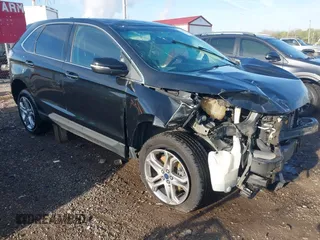 2015 Ford Edge Titanium z VIN 2FMTK4K96FBB48330, wystawiony jako IAAI lot #42080224 z przebiegiem 165 125 mil mil oraz . Historia ofert i sprzedaży dostępna na DreamBid. Obrazek 1.