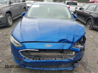 2017 Ford Fusion SE z VIN 3FA6P0H77HR309263, wystawiony jako IAAI lot #41914769 z przebiegiem 136 833 mil mil oraz . Historia ofert i sprzedaży dostępna na DreamBid. Obrazek 6.