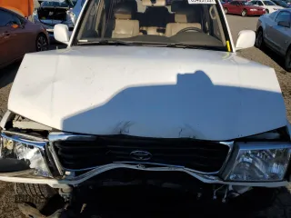 2000 Toyota Land Cruiser with VIN JT3HT05J5Y0105435, listed as a Copart auction lot 89409795 with 255,587 mi miles and Salvage Title. Bid and sale history available at carsss.com. Image 11.