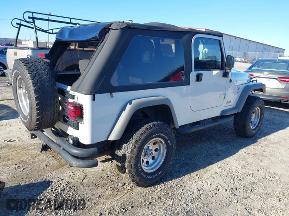 2005 Jeep Wrangler Unlimited with VIN 1J4FA44SX5P316055, listed as a IAAI auction lot 41586898 with 218,181 mi miles. Bid and sale history available at carsss.com. Image 4.