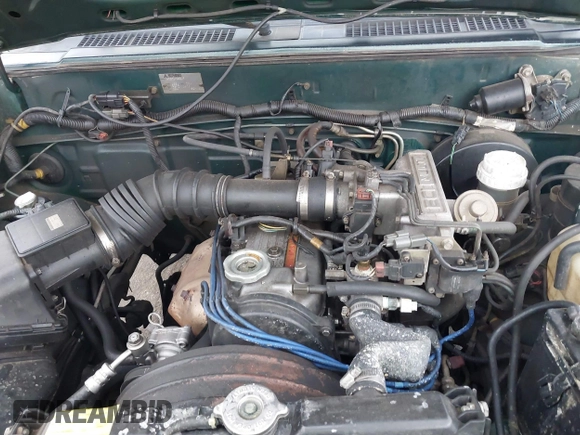 1992 Mitsubishi Mighty Max z VIN JA7FL24W5NP011633, wystawiony jako IAAI lot #41864873 z przebiegiem 301 895 mil mil oraz . Historia ofert i sprzedaży dostępna na DreamBid. Obrazek 10.