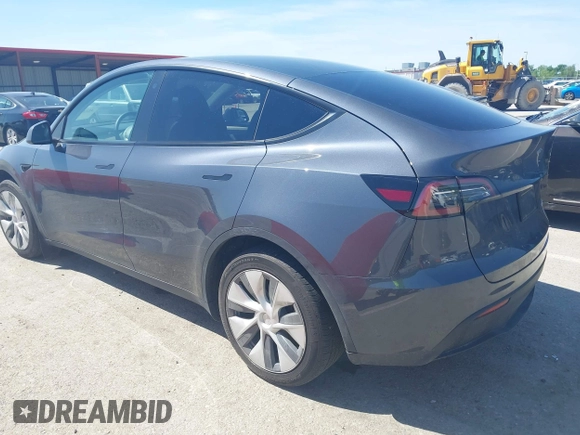 2023 Tesla Model Y Long Range with VIN 7SAYGDEE4PA037218, listed as a IAAI auction lot 42232704 with 18,756 mi miles and . Bid and sale history available at DreamBid. Image 3.