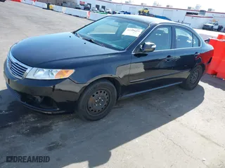 2009 Kia Optima LX with VIN KNAGE228895356658, listed as a IAAI auction lot 41580009 with 216,534 mi miles. Bid and sale history available at carsss.com. Image 2.
