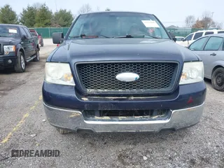 2005 Ford F-150 XLT with VIN 1FTPX12565NA61341, listed as a IAAI auction lot 41693609 with 401,988 mi miles. Bid and sale history available at carsss.com. Image 6.