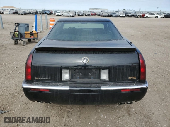1999 Cadillac Eldorado Touring z VIN 1G6ET1298XU602343, wystawiony jako Copart lot #44327195 z przebiegiem 52 327 mil mil oraz Szkody całkowita. Historia ofert i sprzedaży dostępna na DreamBid. Obrazek 6.