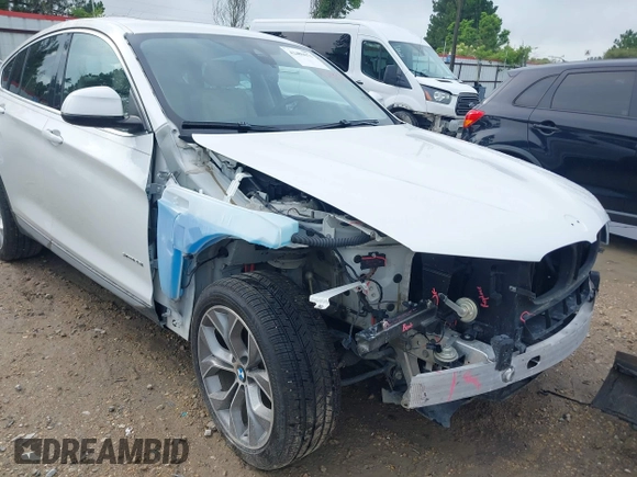 2015 BMW X4 xDrive28i with VIN 5UXXW3C51F0M86668, listed as a IAAI auction lot 42489071 with 59,694 mi miles and . Bid and sale history available at DreamBid. Image 6.