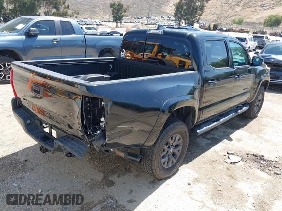2023 Toyota Tacoma SR with VIN 3TMCZ5AN1PM654572, listed as a IAAI auction lot 42312575 with 14,111 mi miles and . Bid and sale history available at DreamBid. Image 4.