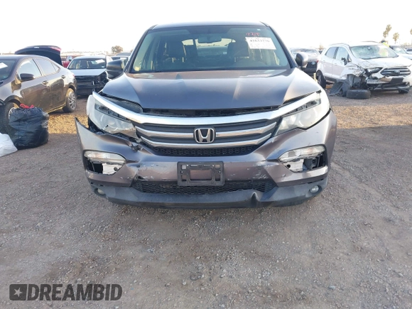 2017 Honda Pilot EX-L with VIN 5FNYF5H74HB010026, listed as a IAAI auction lot 41633770 with 170,383 mi miles and . Bid and sale history available at DreamBid. Image 6.