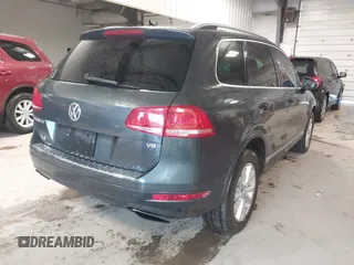 2013 Volkswagen Touareg Lux with VIN WVGEF9BP6DD007032, listed as a IAAI auction lot 41684721 with 147,249 mi miles and . Bid and sale history available at DreamBid. Image 4.