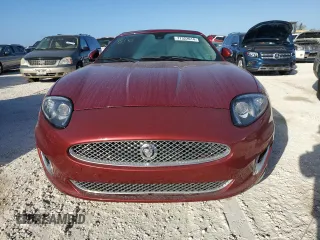 2013 Jaguar XK with VIN SAJWA4GB9DLB51059, listed as a Copart auction lot 77322014 with 0 mi miles and Salvage Title. Bid and sale history available at carsss.com. Image 5.
