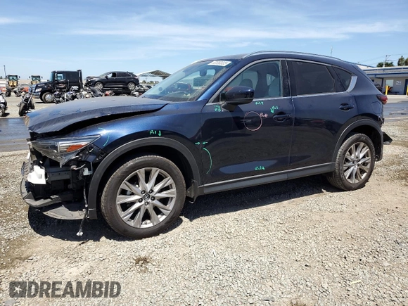 2020 Mazda CX-5 Grand Touring z VIN JM3KFADM4L0794765, wystawiony jako Copart lot #63850005 z przebiegiem 53 270 mil mil oraz Szkoda całkowita • Salvage title. Historia ofert i sprzedaży dostępna na DreamBid. Obrazek 1.