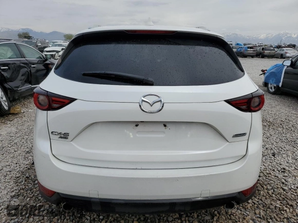 2018 Mazda CX-5 Grand Touring with VIN JM3KFBDM9J0468463, listed as a Copart auction lot 54524805 with 73,389 mi miles and Salvage Title. Bid and sale history available at DreamBid. Image 6.