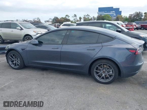 2023 Tesla Model 3 with VIN 5YJ3E1EA4PF410060, listed as a IAAI auction lot 42067624 with 59,934 mi miles and . Bid and sale history available at DreamBid. Image 14.
