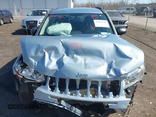 2013 Jeep Compass Latitude with VIN 1C4NJDEB2DD263920, listed as a IAAI auction lot 41832542 with 128,018 mi miles. Bid and sale history available at carsss.com. Image 12.