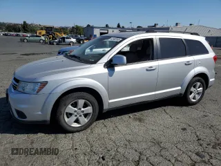 2012 Dodge Journey SXT with VIN 3C4PDDBG0CT293331, listed as a Copart auction lot 62602995 with 185,605 mi miles and Salvage title. Bid and sale history available at DreamBid. Image 1.