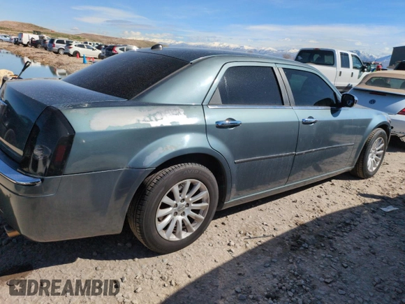 2005 Chrysler 300 with VIN 2C3AA63H35H659798, listed as a Copart auction lot 50322065 with 153,944 mi miles and Salvage Title. Bid and sale history available at carsss.com. Image 3.