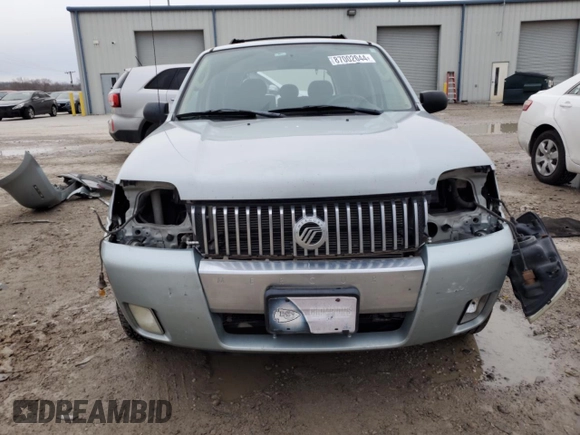 2005 Mercury Mariner Luxury z VIN 4M2CU57105DJ33266, wystawiony jako Copart lot #87002044 z przebiegiem 164 313 mil mil oraz Szkody całkowita. Historia ofert i sprzedaży dostępna na DreamBid. Obrazek 5.