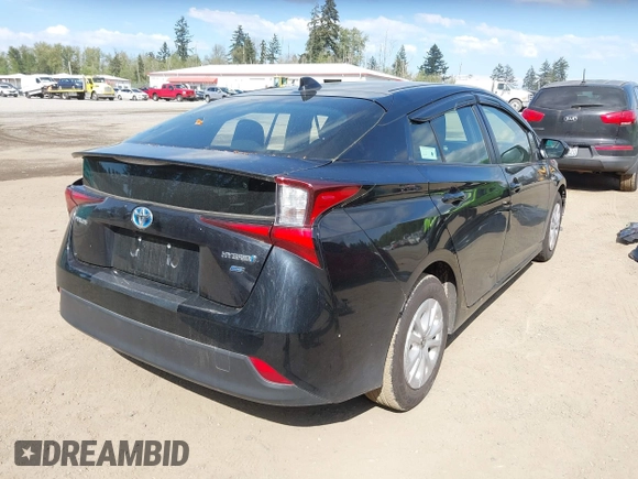 2021 Toyota Prius L Eco with VIN JTDKAMFU3M3140233, listed as a IAAI auction lot 42182685 with 38,842 mi miles and . Bid and sale history available at DreamBid. Image 4.