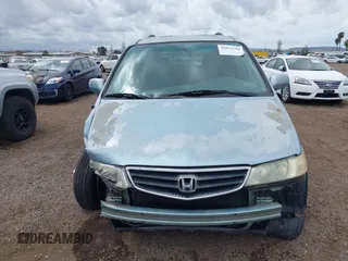 2004 Honda Odyssey EX-L with VIN 5FNRL18064B060817, listed as a IAAI auction lot 42032796 with 200,999 mi miles and . Bid and sale history available at DreamBid. Image 13.