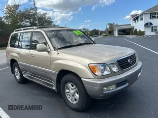 1998 Lexus LX 470 with VIN JT6HT00W7W0008417, listed as a Copart auction lot 79324334 with 183,911 mi miles and Clean Title. Bid and sale history available at DreamBid. Image 1.