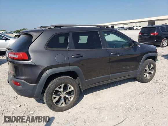 2014 Jeep Cherokee Trailhawk with VIN 1C4PJMBS1EW304718, listed as a Copart auction lot 64105485 with 151,315 mi miles and Salvage title. Bid and sale history available at DreamBid. Image 3.