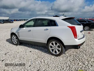 2014 Cadillac SRX Performance Collection with VIN 3GYFNCE39ES687733, listed as a Copart auction lot 62770665 with 151,714 mi miles and Salvage title. Bid and sale history available at DreamBid. Image 2.