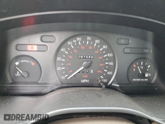 1996 Ford Contour with VIN 3FALP6535TM129390, listed as a Copart auction lot 73338064 with 87,588 mi miles and Salvage title. Bid and sale history available at DreamBid. Image 9.