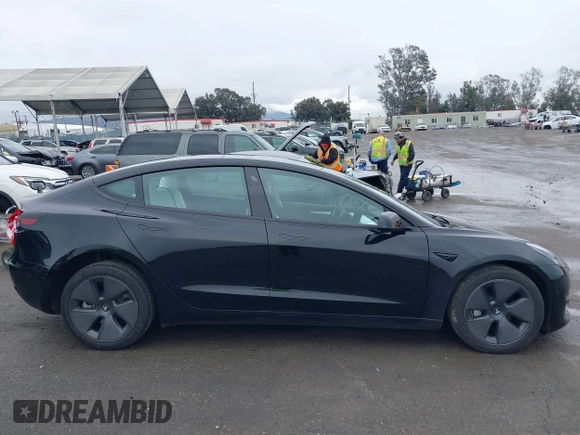 2023 Tesla Model 3 with VIN 5YJ3E1EA0PF587656, listed as a IAAI auction lot 41489586 with 12,844 mi miles and . Bid and sale history available at DreamBid. Image 14.