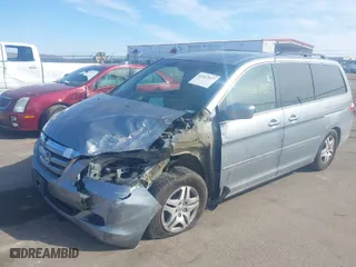 2007 Honda Odyssey EX-L with VIN 5FNRL38687B116051, listed as a IAAI auction lot 41867877 with 143,860 mi miles. Bid and sale history available at carsss.com. Image 2.