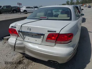 2001 Mazda Millenia with VIN JM1TA221011711379, listed as a IAAI auction lot 41897580 with 151,307 mi miles and . Bid and sale history available at DreamBid. Image 6.