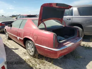 2000 Cadillac Eldorado z VIN 1G6EL12Y7YU198685, wystawiony jako Copart lot #75093094 z przebiegiem Nie podano mil oraz Szkody całkowita. Historia ofert i sprzedaży dostępna na DreamBid. Obrazek 2.