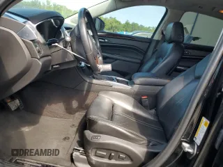 2014 Cadillac SRX Premium Collection with VIN 3GYFNDE35ES591071, listed as a Copart auction lot 57891265 with 134,560 mi miles and Salvage title. Bid and sale history available at DreamBid. Image 7.