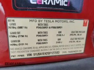 2016 Tesla Model S 90D with VIN 5YJSA1E42GF127593, listed as a Copart auction lot 52450495 with 144,151 mi miles and Salvage title. Bid and sale history available at DreamBid. Image 14.