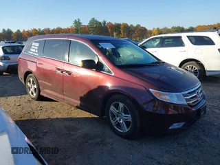 2012 Honda Odyssey Touring z VIN 5FNRL5H9XCB067841, wystawiony jako IAAI lot #40631672 z przebiegiem 210 237 mil mil oraz . Historia ofert i sprzedaży dostępna na DreamBid. Obrazek 1.