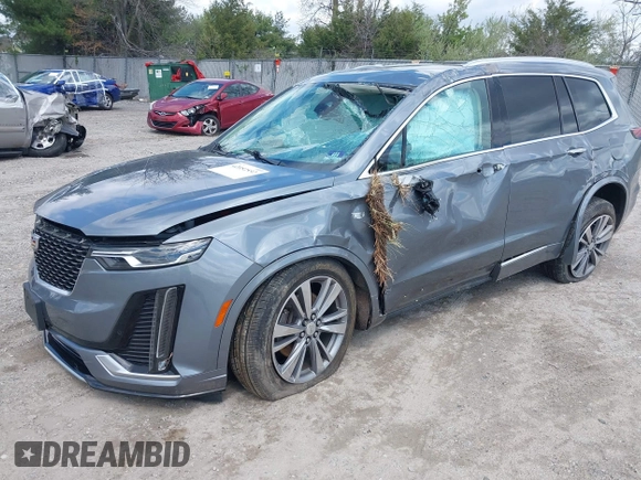 2020 Cadillac XT6 FWD Premium Luxury z VIN 1GYKPCRS9LZ129763, wystawiony jako IAAI lot #42052532 z przebiegiem 57 670 mil mil oraz . Historia ofert i sprzedaży dostępna na DreamBid. Obrazek 16.