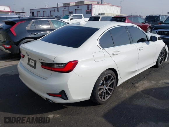 2021 BMW 3 Series 330e with VIN 3MW5P7J00M8C21180, listed as a IAAI auction lot 41451850 with 70,459 mi miles. Bid and sale history available at carsss.com. Image 4.