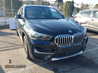 2021 BMW X1 sDrive28i with VIN WBXJG7C05M5U23561, listed as a IAAI auction lot 41403424 with 24,616 mi miles. Bid and sale history available at carsss.com. Image 1.