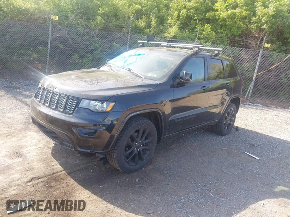 2018 Jeep Grand Cherokee Laredo E with VIN 1C4RJFAG2JC320441, listed as a IAAI auction lot 42095419 with 136,962 mi miles. Bid and sale history available at carsss.com. Image 2.