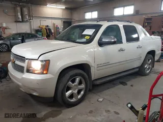 2012 Chevrolet Avalanche LTZ with VIN 3GNTKGE71CG115669, listed as a IAAI auction lot 41851031 with 128,873 mi miles. Bid and sale history available at carsss.com. Image 2.