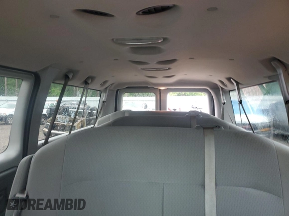 2009 Ford Econoline Passenger XL with VIN 1FBNE31L49DA74498, listed as a Copart auction lot 56381945 with 95,695 mi miles and Salvage title. Bid and sale history available at DreamBid. Image 10.
