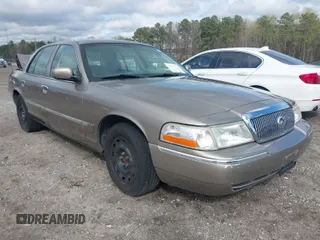 2005 Mercury Grand Marquis GS z VIN 2MEFM74W55X603152, wystawiony jako IAAI lot #41872534 z przebiegiem 84 290 mil mil oraz . Historia ofert i sprzedaży dostępna na DreamBid. Obrazek 1.