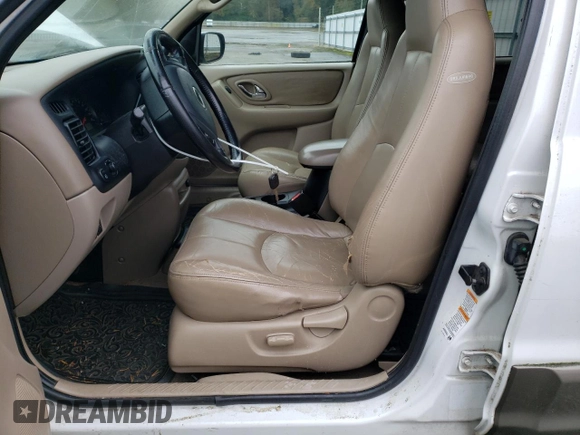 2001 Mazda Tribute LX with VIN 4F2CU08101KM11452, listed as a Copart auction lot 76796064 with 175,584 mi miles and Salvage Title. Bid and sale history available at DreamBid. Image 7.