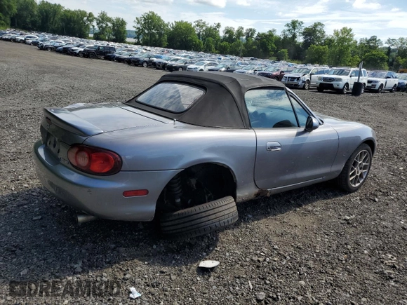 2002 Mazda MX-5 Miata Cloth z VIN JM1NB353520224582, wystawiony jako Copart lot #63669835 z przebiegiem 88 455 mil mil oraz Szkoda całkowita • Salvage title. Historia ofert i sprzedaży dostępna na DreamBid. Obrazek 3.