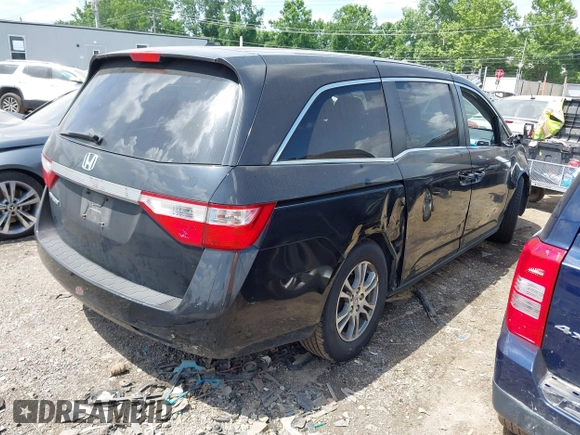 2011 Honda Odyssey EX-L with VIN 5FNRL5H62BB063125, listed as a IAAI auction lot 42562541 with 140,787 mi miles and . Bid and sale history available at DreamBid. Image 4.