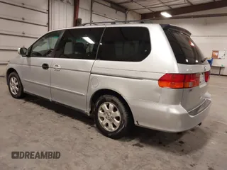 2004 Honda Odyssey EX-L with VIN 5FNRL18974B127696, listed as a IAAI auction lot 41643243 with 200,286 mi miles and . Bid and sale history available at DreamBid. Image 3.
